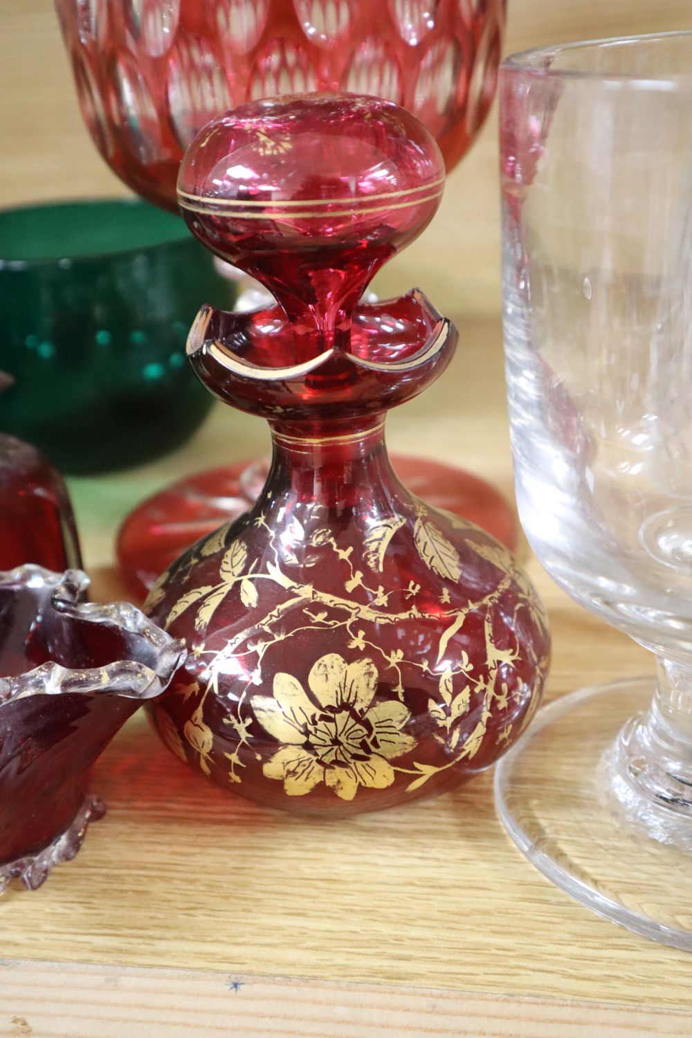 A claret jug with plated mount, Victorian rummer, three Bristol green glass bowls, ruby and cranberry glassware etc.